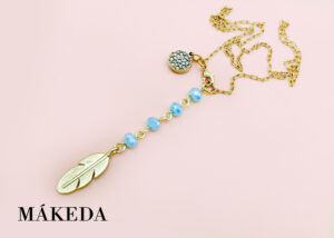 Makeda joyeria, Dije Pluma en Chapa de Oro y Cristales