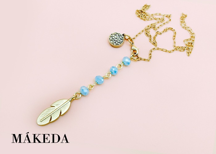 Makeda joyeria, Dije Pluma en Chapa de Oro y Cristales
